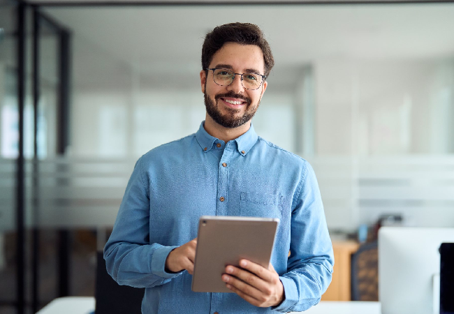 Professional working on iPad while posing for a picture